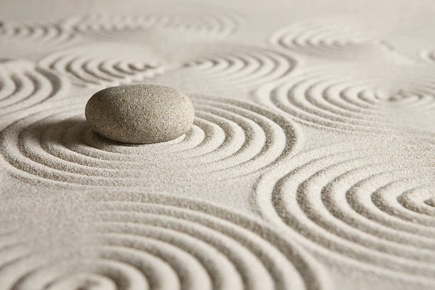 Stone on sand background
